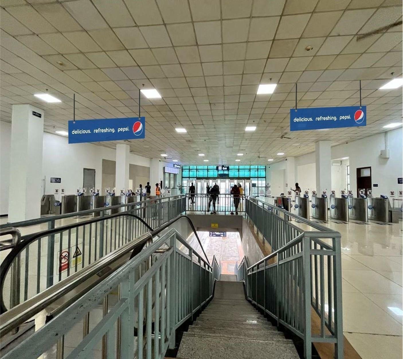 Platform 1 and 2 gates by staircase, double-sided A1 ceiling drop-down — Ceiling drop-down